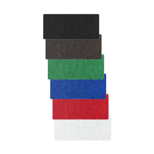 Sechs Arcora HANDPAD - DICK 250 x 15 cm Matten von Arcora International GmbH sind in den Farben schwarz, braun, grün, blau, rot und weiß senkrecht gestapelt - ideal als Handpad oder Reinigungswerkzeug zum Polieren von Metall.