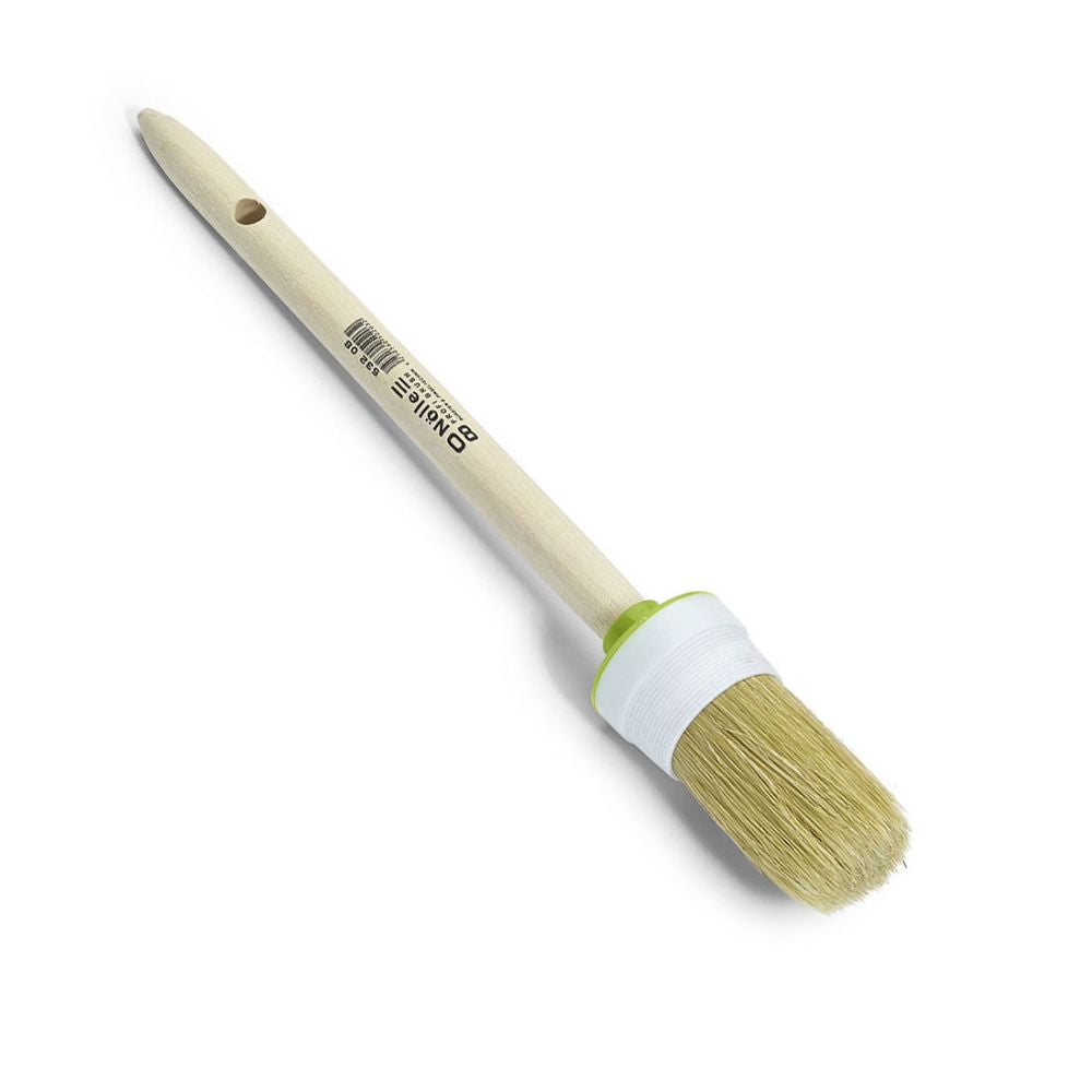 The Nölle Profi Brush industrial round brush features a round wooden handle with a hole at the end, a light bristle mix, and is manufactured in industrial quality. A green ring accents the base.