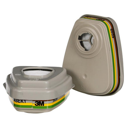 Two gray 3M™ Filter Set 6004-1 ABEK1P3 Combination Filter Cartridges (2x6059, 2x5935, 2x501) from 3M Deutschland GmbH, with yellow, green, and brown stripes, shown upright and lying on their side against a white background.