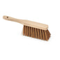 The Nölle Profi Brush industrial hand broom, 28 cm poly-coconut with hanging hole by Nölle Profi Brush Bürsten- & Pinseltechnik e.K., has stiff brown bristles and a light wooden handle, photographed on a white background.