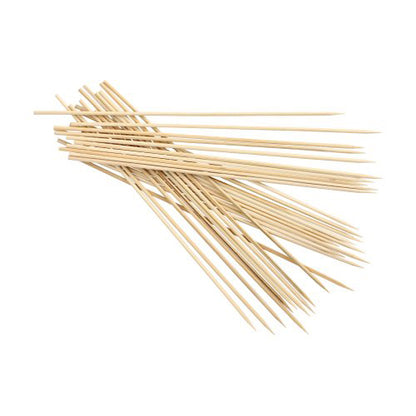 On a white background lies a stack of PAPSTAR 1000 skewer sticks, bamboo “pure” from PAPSTAR GmbH with pointed ends, offering an eco-friendly way to grill and serve snacks.