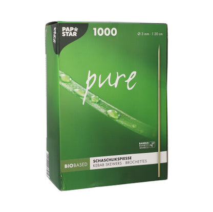 A green box with the inscription “PAPSTAR 1000 skewer sticks, bamboo pure” from PAPSTAR GmbH contains 1,000 eco-friendly bamboo skewers (20 cm x 3 mm). The packaging features skewered foods and a close-up of a green leaf with water droplets.