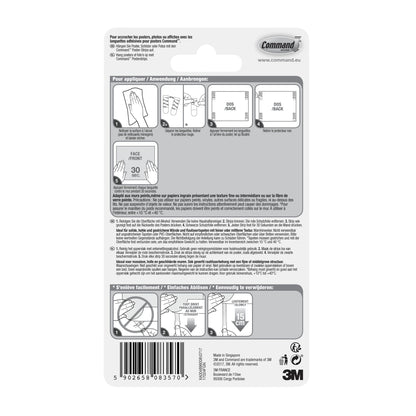 Back of a package of Command™ Poster Strips 17024 from 3M Deutschland GmbH with illustrated step-by-step instructions for residue-free mounting and poster attachment in multiple languages, with diagrams, barcode, and 3M branding at the bottom right.
