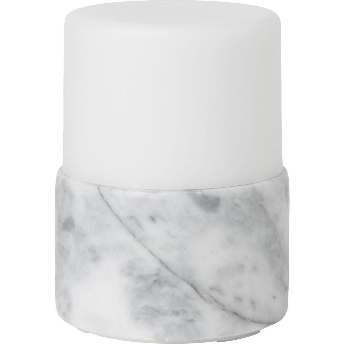 The LED candle holder Stone by Duni GmbH (105x75 mm, 1 piece) with a white-marble design and matte lid adds a stylish accent to any table and provides bright light for your decoration.
