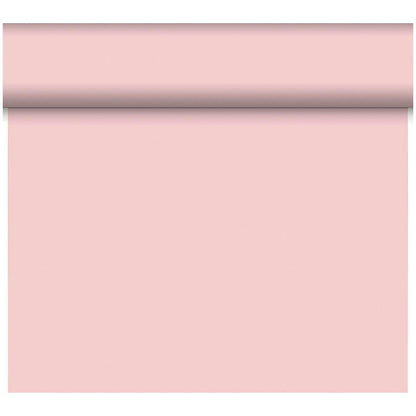 A roll of Dunicel table runner Tête-à-Tête 24 m x 0.4 m (20 sections) by Duni GmbH is vertically unrolled, presenting the delicate pink surface as a stylish table decoration against a white background.