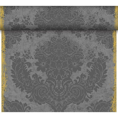 A close-up of the ornate floral damask wallpaper in dark gray, reflecting the elegant style of the Dunicel table runner Tête-à-Tête 24 m x 0.4 m (20 sections) by Duni GmbH, with distressed textures and worn gold edges, ideal for table decoration.