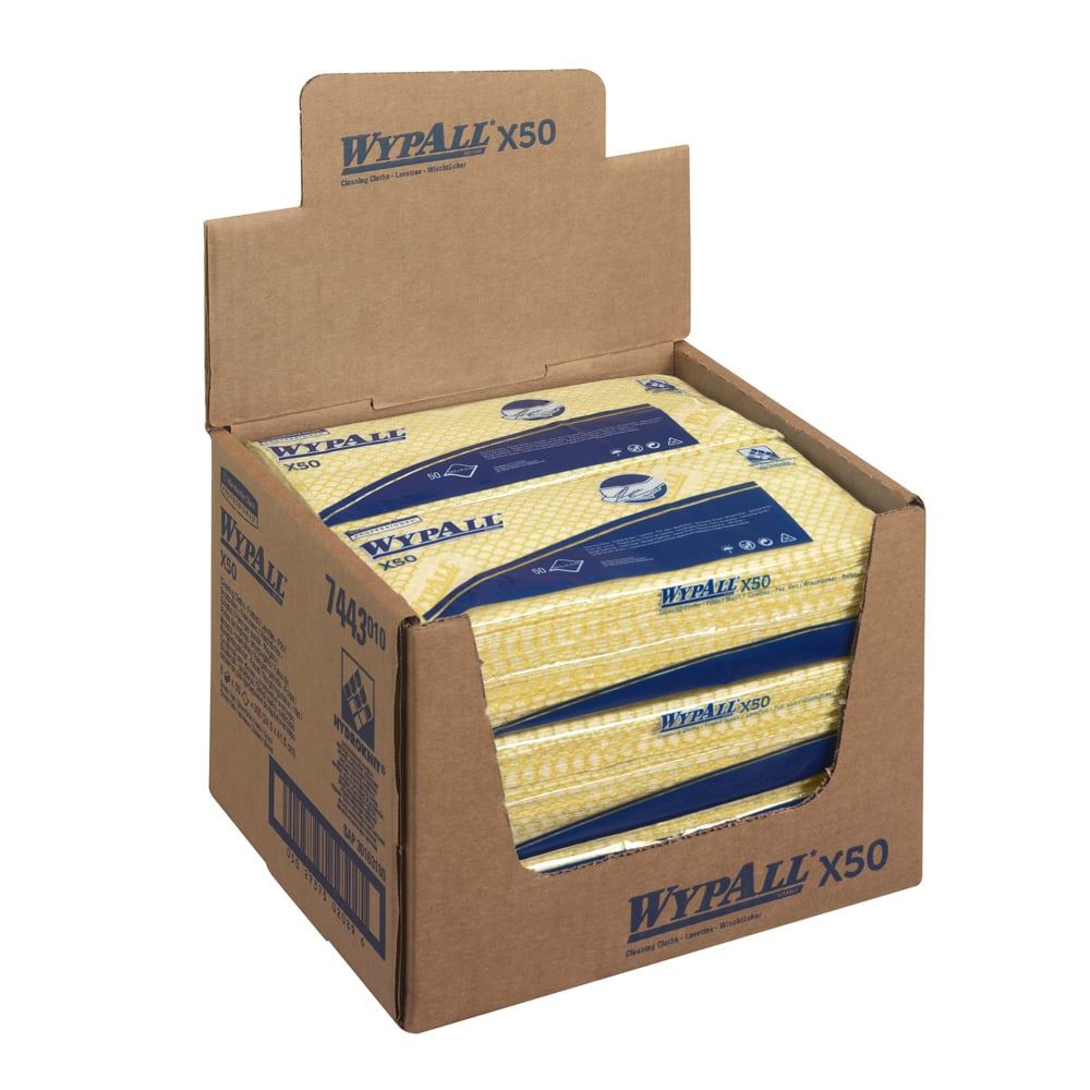 A brown carton labeled "WypAll® X50 Wipers - Interfold / 41.80 cm x 24.70 cm" from Kimberly-Clark GmbH contains yellow and blue industrial cleaning cloths, some of which are visible through the top opening.