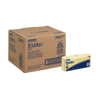 A carton labeled WypAll® X50 Wipers - Interfold (41.80 cm x 24.70 cm) from Kimberly-Clark GmbH stands next to a stack of folded yellow WypAll® X50 Wipers, both with brand and item information.