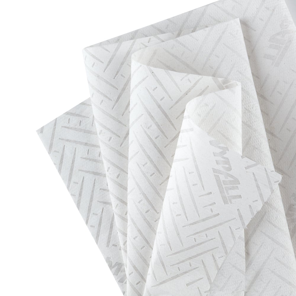 A stack of WypAll® Reach™ paper towel for food & hygiene - centerfeed from Kimberly-Clark GmbH with a subtle diagonal line pattern and faint "WYPALL" branding, ideal for food hygiene, on a white surface.