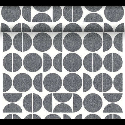 The Dunicel table runner Tête-à-Tête (24 m x 0.4 m, 20 sections) by Duni GmbH displays black and white geometric patterns - full circles, half circles, and segmented circles - ideal for a modern Tête-à-Tête table decoration.