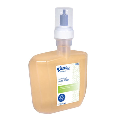 A rectangular, clear plastic bottle of Kleenex® Botanics™ Luxury Foam Hand Wash by Kimberly-Clark GmbH has a pump dispenser, orange liquid, a detailed label, and a 1.2-L cassette (1200 ml). The package contains 4 electronic cassettes per carton.