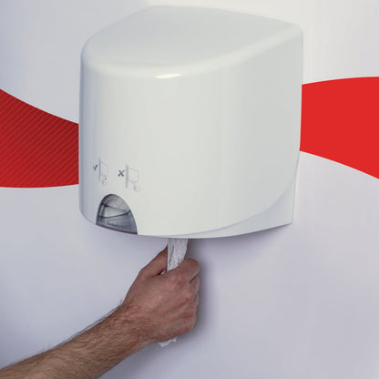 A person pulls a WypAll® L10 paper towel from Kimberly-Clark GmbH out of a white, wall-mounted centrefeed for Reach+™ dispenser (38.00 cm x 18.30 cm) attached to the wall with a red stripe.