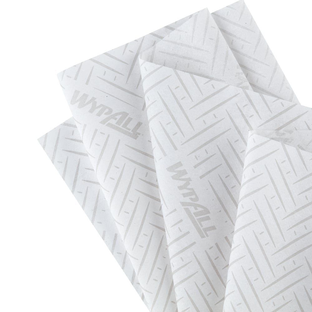 Four overlapping WypAll® L20 paper towels (38.00 x 18.30 cm) from Kimberly-Clark GmbH, white with a subtle chevron and line pattern and faint "WypAll" branding, ideal for industrial cleaning tasks, are fanned out.