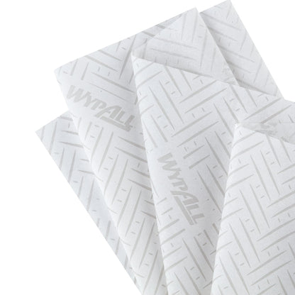 Four overlapping WypAll® L20 paper towels (38.00 x 18.30 cm) from Kimberly-Clark GmbH, white with a subtle chevron and line pattern and faint "WypAll" branding, ideal for industrial cleaning tasks, are fanned out.