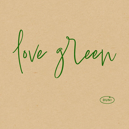 Green italic text reading "love green" appears on a brown paper background. At the bottom right is a small green oval logo with "DUNI" highlighting the organic Dunisoft napkin. 20x20cm eco-friendly napkins from Duni GmbH.