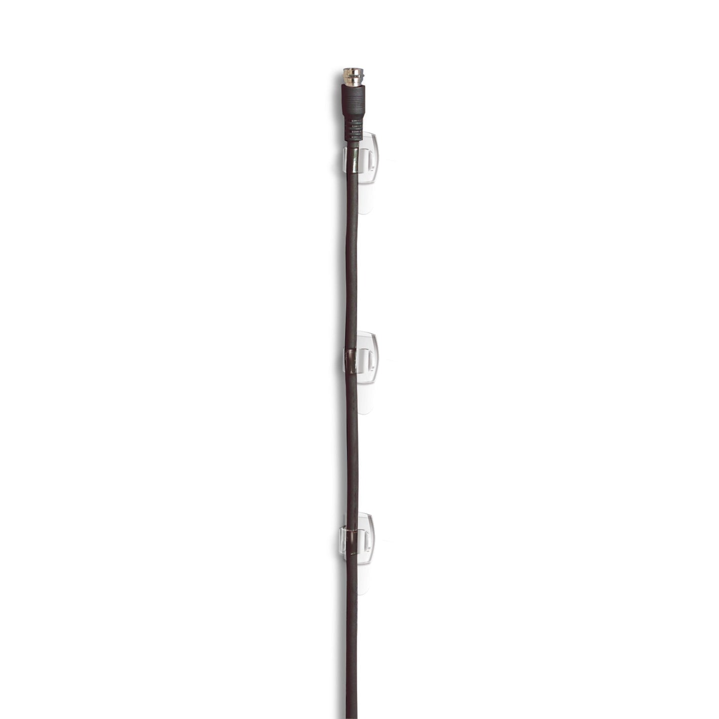 A black coaxial cable is vertically attached to a white wall with three Command™ transparent clips for round cables, 17017CLR from 3M Deutschland GmbH, with each clip serving as a secure cable holder and evenly distributed along the cable.
