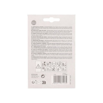 On the back of the PAPSTAR anniversary candles with holder 7 cm "silver" from PAPSTAR GmbH, there are multilingual safety instructions, care symbols, a barcode, warning and recycling symbols, and product information in small black print on white packaging.
