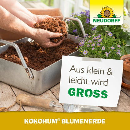 A person fills a metal container by hand with Kokohum Flower Soil from Neudorff Shop. Nearby, a potted plant with purple and white blossoms blooms, accompanied by German text promoting this flower soil.
