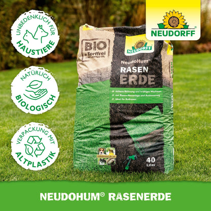 A 40-liter bag of NeudoHum Lawn Soil from Neudorff Shop lies on the lawn - ideal for new lawn areas. The packaging offers safety for pets, natural organic contents, and is environmentally friendly with recycled plastic.