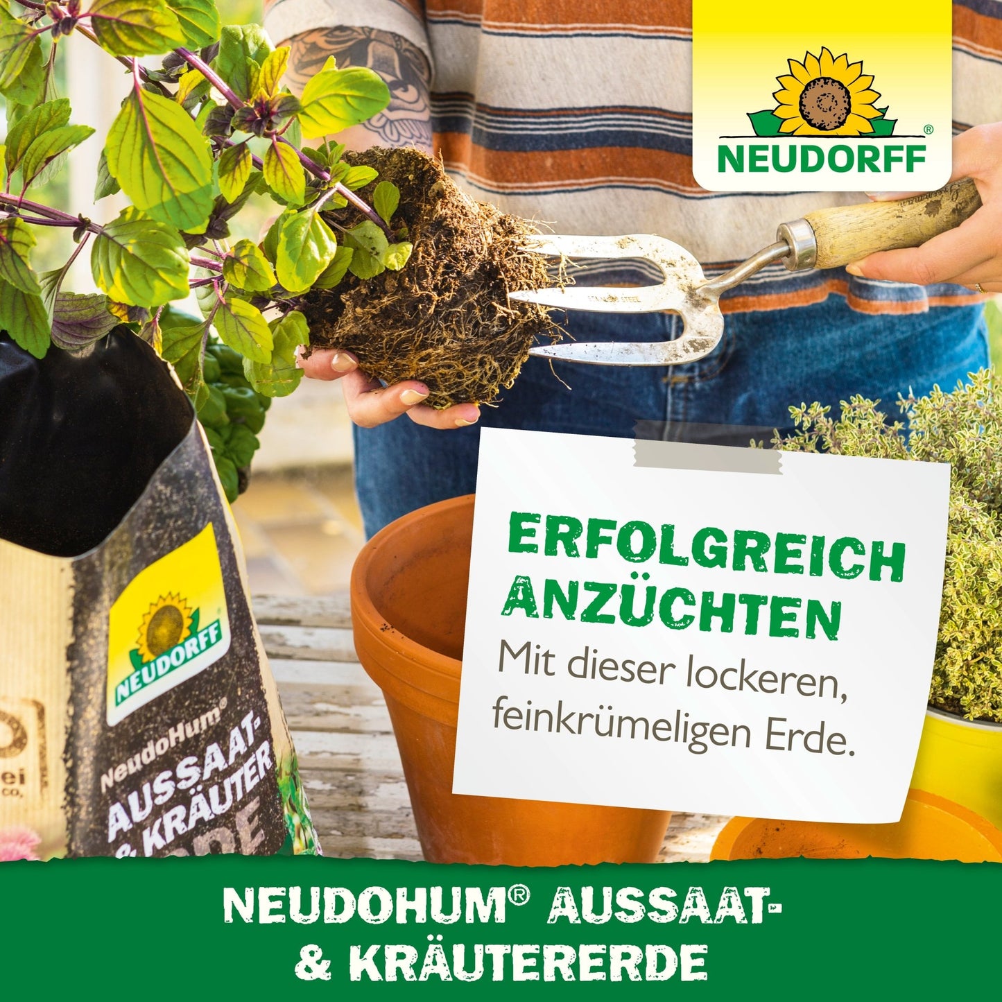 A person uses a garden fork to prepare the soil in a rectangular planter. Next to it stands a bag of NeudoHum Seed & Herb Soil from Neudorff Shop with Mediterranean herbs, herb plants, branding, and German advertising text.