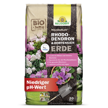 A 20-liter bag of NeudoHum Rhododendron & Hydrangea Soil from Neudorff Shop shows pictures of hydrangeas and rhododendrons and promotes optimal plant growth due to its low pH value.