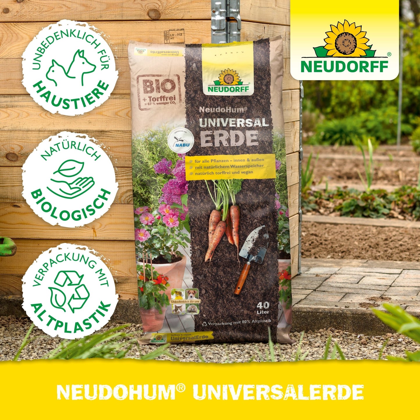 A bag of Neudorff Shop NeudoHum Universal Soil stands upright in a garden. Three circular symbols indicate that it is pet-friendly, organically grown, and made from recycled plastic. The Neudorff Shop logo is in the upper right corner.