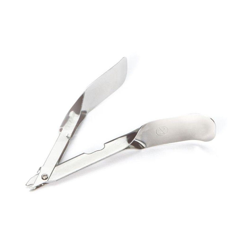 The sterile Hartmann MediSet® staple remover by Paul Hartmann AG, individually packaged (1 piece), with two flat, spatula-shaped arms and a curved handle, is seen on a white background - ideal for medical professionals.
