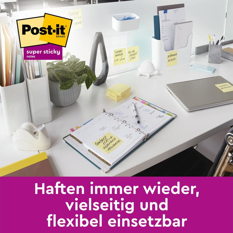 A modern office desk with a laptop, an open planner, stationery, and scattered Post-it® Super Sticky Z-Notes (Yellow, 76x127 mm, 90 sheets/block). Text: "Sticks again and again - versatile & flexible. 3M Deutschland GmbH.