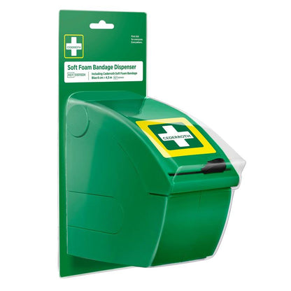 The Cederroth Soft Foam Bandage Dispenser (blue) from Orkla Wound Care AB is a blue dispenser mounted on a back panel card labeled "Soft Foam Bandage Dispenser." With a pull-down front and a cross symbol, it is ideal for providing quick first aid with self-adhesive bandages.