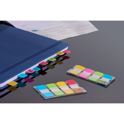 A blue folder uses 3M Post-it® Index Strong Filing Tabs (Mini, Yellow, Red, Blue, Green) to mark sections I-IV. Two packs of assorted sticky tabs in their dispensers lie on a dark surface next to "Organize Documents".
