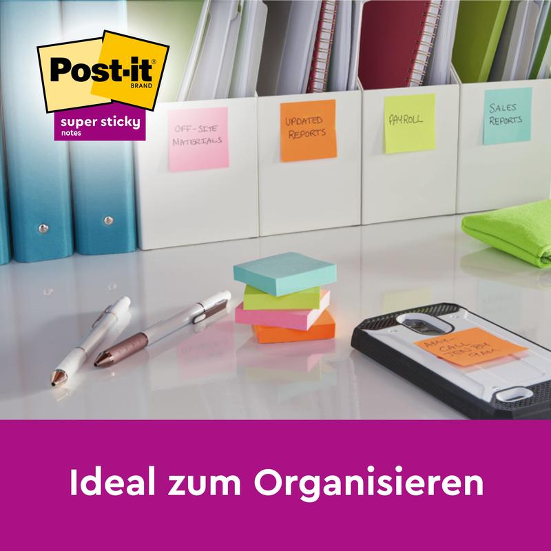 Multiple stacks of 3M Post-it® Super Sticky Notes (76x127 mm, 90 sheets/block, 100% PEFC) lie on a desk with pens, a folder, and files labeled with sticky notes. The text reads "Ideal for organizing" above the Post-it logo.
