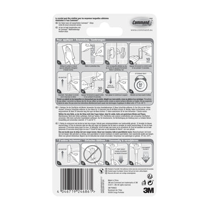 Rückseite einer Command™ Bad Metallhaken "Modern Reflection"-Verpackung der 3M Deutschland GmbH, mit bebilderter Schritt-für-Schritt-Anleitung zum Anbringen und Entfernen des Hakens, mit mehrsprachigem Text und Produktinformationen am unteren Rand.
