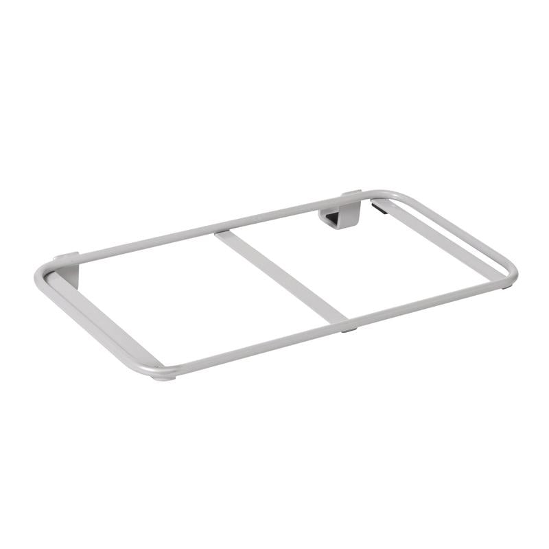 A silver rectangular metal frame with two rods, mounted on a white wall, serves as a waste bag or laundry bag extension for the TASKI Nano Trolley shelf by Diversey Deutschland GmbH & Co. OHG (package of 1 piece).