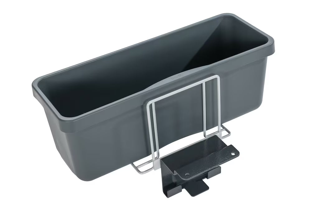 A dark gray rectangular plastic planter box with a Moppbox holder AERO 3500 made of metal and a front mounting bracket from Diversey Deutschland GmbH & Co. OHG, isolated on a white background.