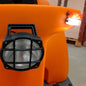 Close-up of a Balimat street set by Diversey Deutschland GmbH & Co. OHG, with a round headlight with a black grille and side lights, ready for road traffic in a warehouse with pallets; suitable for upgrading the Balimat 6500/6500HD.