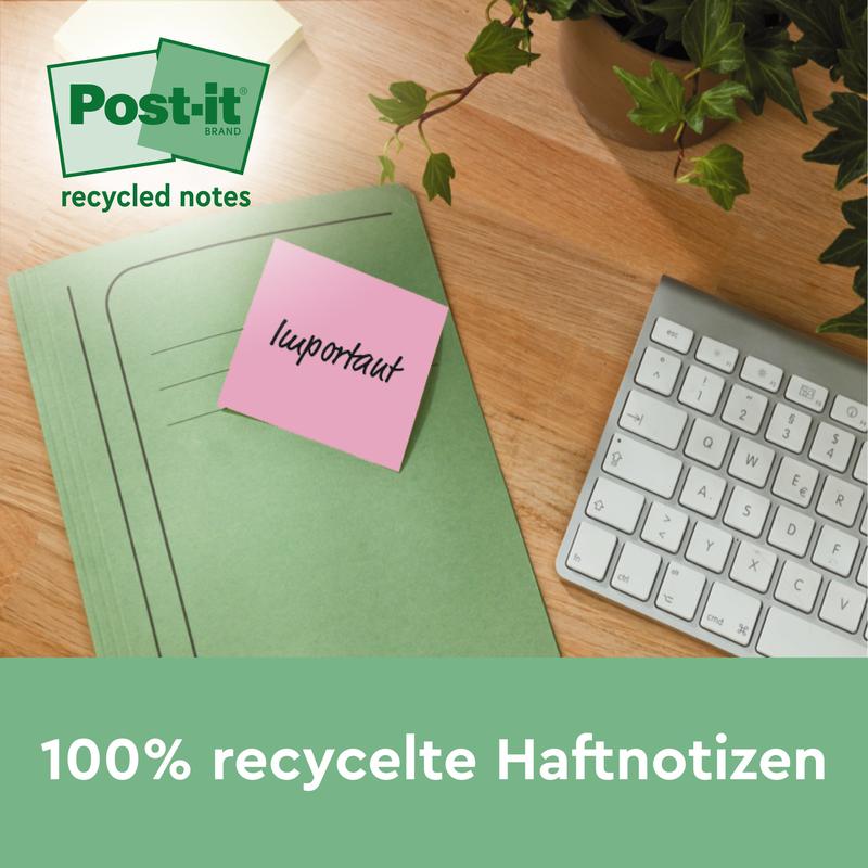 A green folder with a pink Post-it® Recycling Note from 3M Deutschland GmbH (38 mm x 51 mm, 100 sheets/block, 100% PEFC) lies on a wooden table next to a white keyboard and a potted plant.