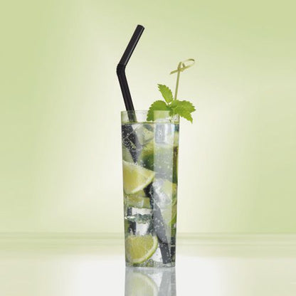 A tall glass with a clear, carbonated drink with lime, ice, and mint is garnished with a PAPSTAR 250 Fingerfood - Picker "pure" of PAPSTAR GmbH and a black straw, against a light green background.