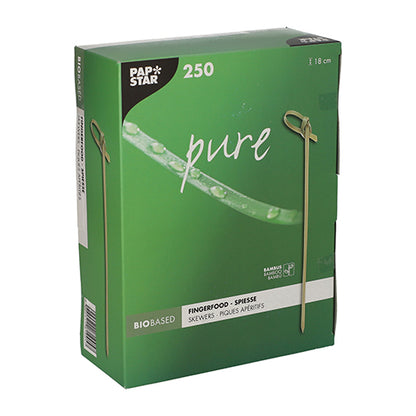 A green box of PAPSTAR 250 Fingerfood-Picker "pure" of PAPSTAR GmbH, each 18 cm long and biodegradable; the packaging shows skewer images and water droplets on a leaf.