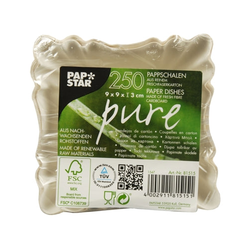 A stack of 100 square, white "pure" cardboard trays (PAPSTAR GmbH) is wrapped in clear plastic and features a multilingual front label showing product details and certification logos for different catering requirements.