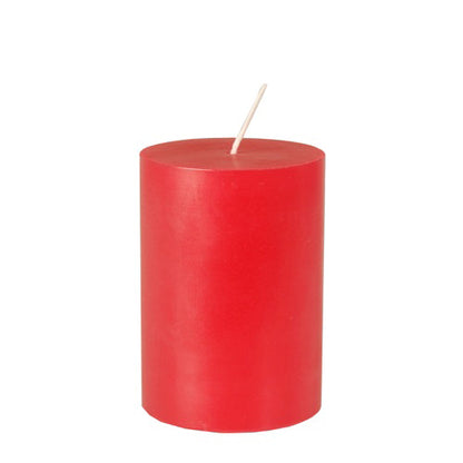 The PAPSTAR GmbH pillar candle Ø 70 mm, 100 mm made of 100% stearin is a dyed, red candle with a white wick and stands upright against a white background.