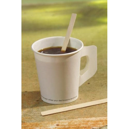 A white paper cup with a flat handle contains coffee and a PAPSTAR stirring stick made from FSC®-certified wood, 17.8 cm "pure" (by PAPSTAR GmbH). Another stirring stick rests next to the cup.