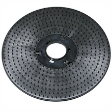 The Diversey Deutschland GmbH & Co. OHG pad holder (43 cm) for swingo 3500 is a round, black plastic floor pad holder with a textured surface, short bristles, and a central hole for attaching cleaning and polishing pads. The package contains 1 piece.