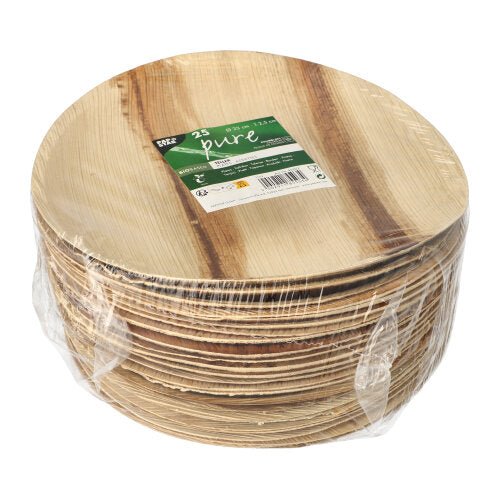 A stack of PAPSTAR 25 plates, palm leaf "pure" round from PAPSTAR GmbH, round biodegradable plates made of clear plastic with a green-white label with brand and quantity - perfect as environmentally friendly disposable tableware for any event.