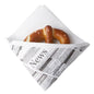 A soft pretzel with visible salt is wrapped in a Starpak 50 snack napkin, fabric-like, Airlaid 1/4-fold 32.5 cm x 30.5 cm white "Newsprint", photographed on a plain white background.