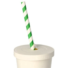 In the PAPSTAR lid for drinking cups, round Ø 8 cm, white, cardboard | foil (50 pieces) of PAPSTAR GmbH, a green-white striped paper straw is inserted into a white disposable cup, which stands against a plain white background.