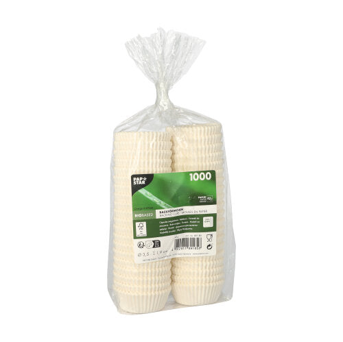 In einem durchsichtigen Plastikbeutel befindet sich ein Stapel von 1.000 PAPSTAR 1000 Backförmchen rund der PAPSTAR GmbH, versehen mit einem grün-weißen Mitteletikett mit Produktdetails.