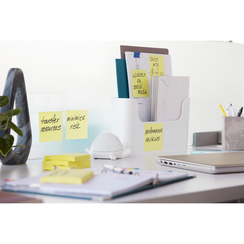 A tidy office desk with folders, notebooks, a small white turtle figure, and a potted plant. Handwritten notes for tasks and reminders with 3M Post-it® Super Sticky Z-Notes, Yellow, 76 x 76 mm (20+4 pack), PEFC-certified.