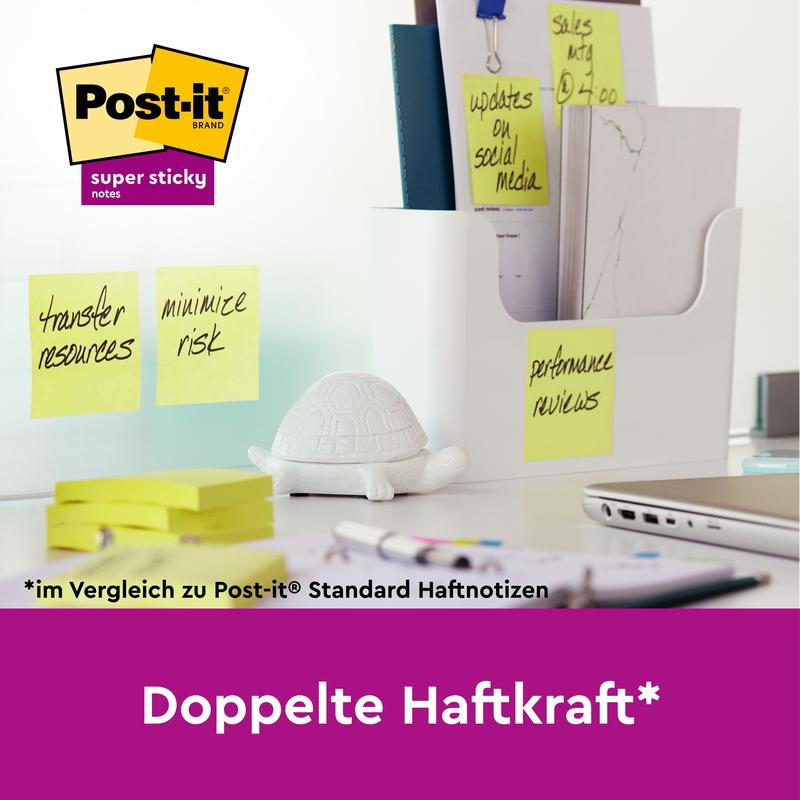 On the desk are 3M Post-it® Super Sticky Notes (76x127mm, 90 sheets, 100% PEFC), a white turtle figure, and a document container. Text: "Double the sticking power*" highlights the stronger adhesion compared to conventional notes.