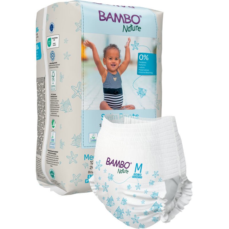 A pack of Bambo Nature swim diapers, size M, 12+ kg (12 pieces) by Abena Re-Seller GmbH features a swim diaper on the front and shows a smiling child in a swimsuit with raised arms on the packaging.