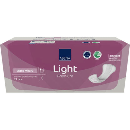 A rectangular box of ABENA Light Ultra Mini 0, Premium from Abena Re-Seller GmbH (24 pieces) features a purple design, a product image, and icons highlighting the discreet protection for pantyliner users.